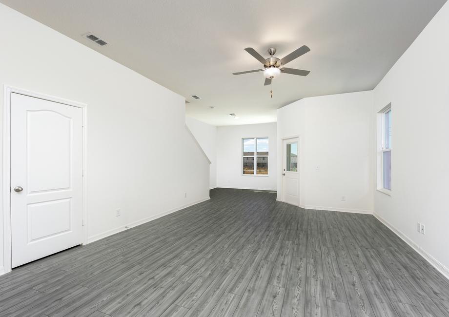 A spacious family room and adjoining kitchen