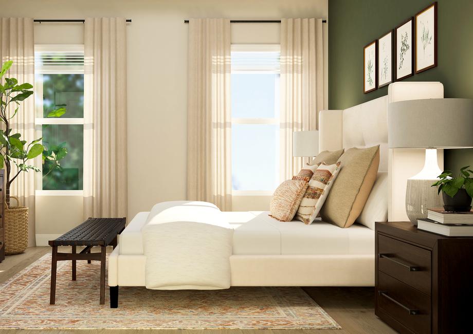 Rendering of the master suite in the Iris
  floor plan, showcasing the two large windows that provide natural light. The
  room is furnished with a dresser, potted tree, bed, two nightstands and a
  bench.