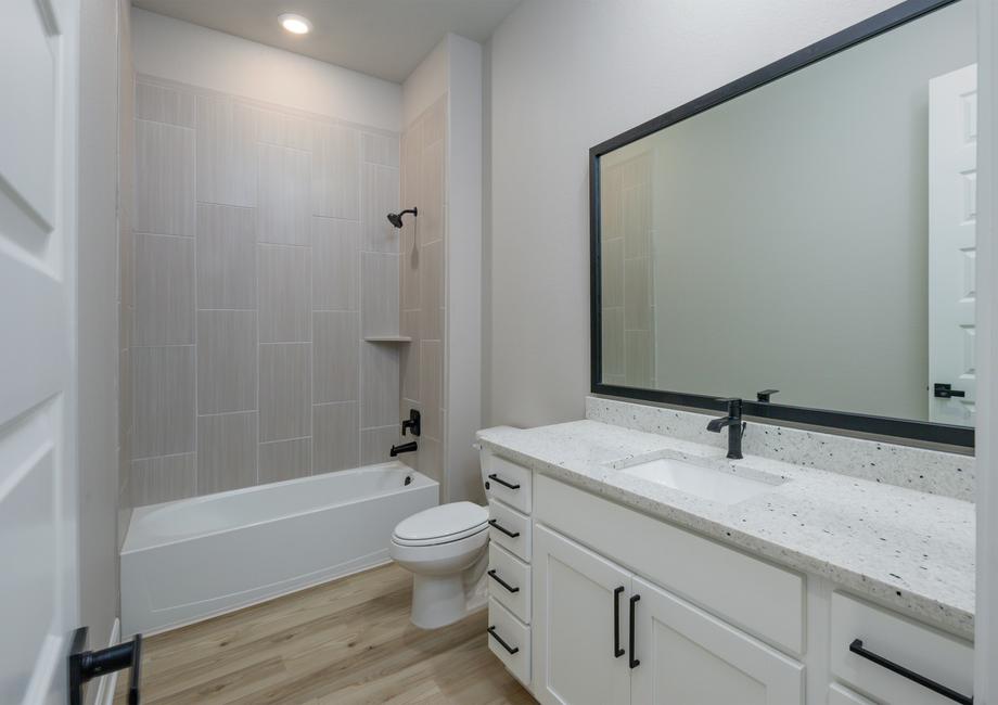 The secondary bedroom has plenty of storage space with a large vanity.