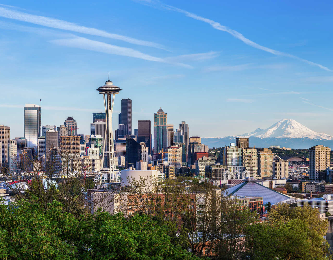 Panorama view of Seattle downtown skyline and Mt. Rainier, Washington.