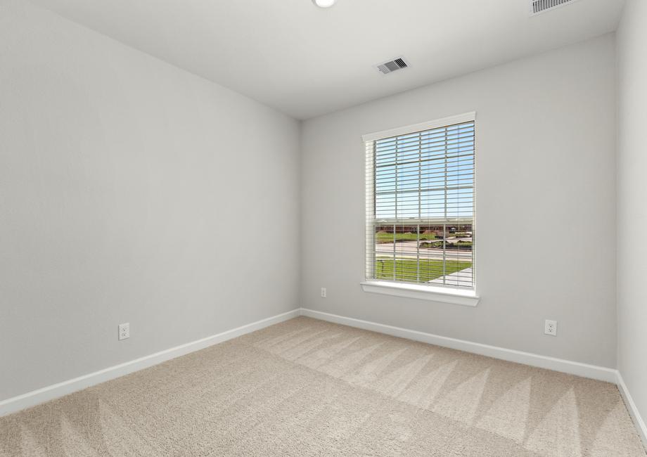 Another bedroom with lush carpet