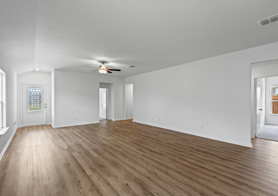 A spacious family room with two windows