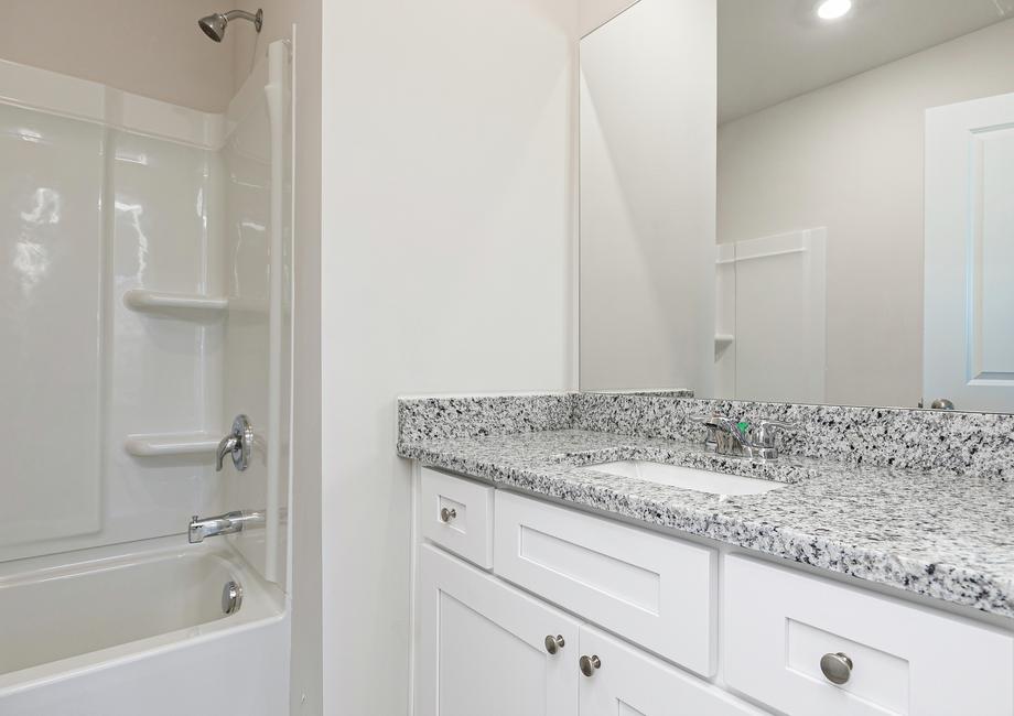 Get ready for your day in the gorgeous master bathroom