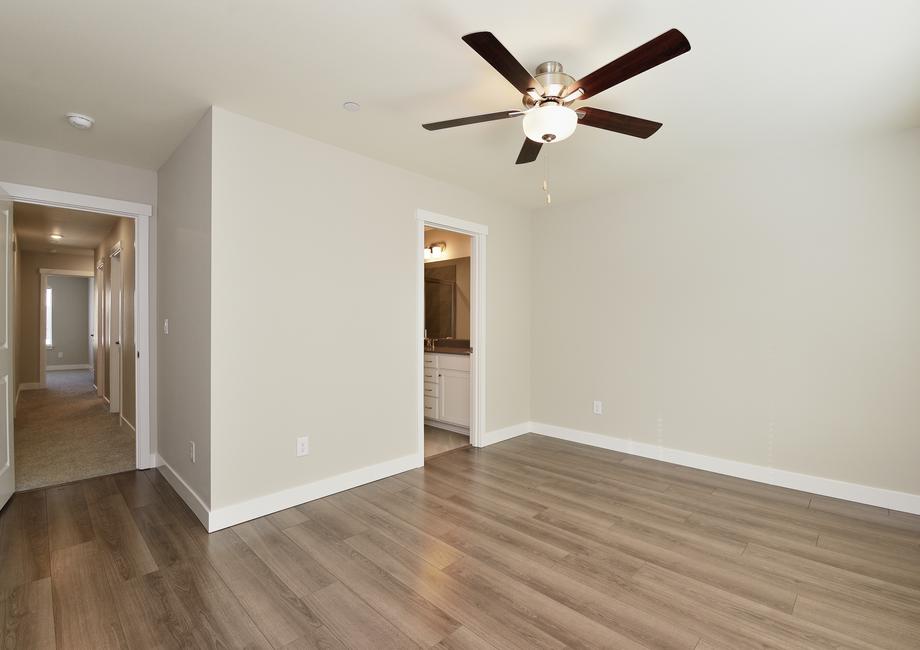 The master bedroom has plank flooring.