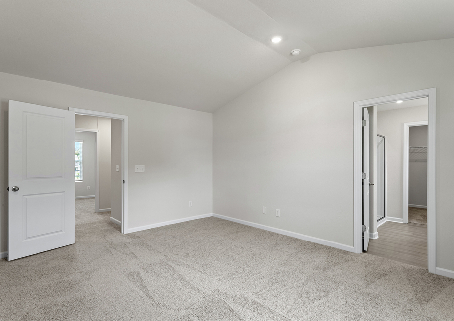 The master bedroom has an attached bathroom and walk-on closet. 