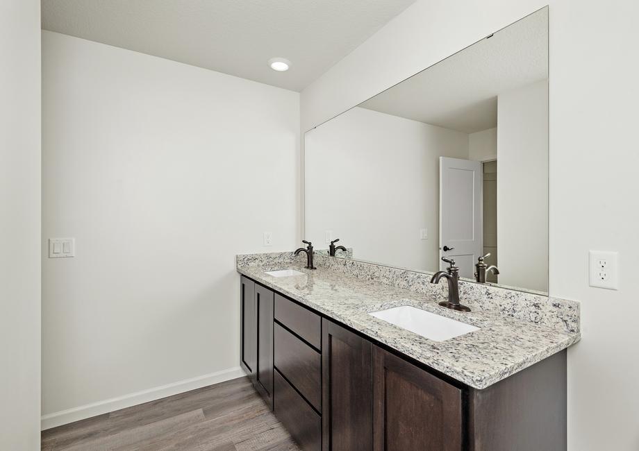 The master bathroom has a large vanity