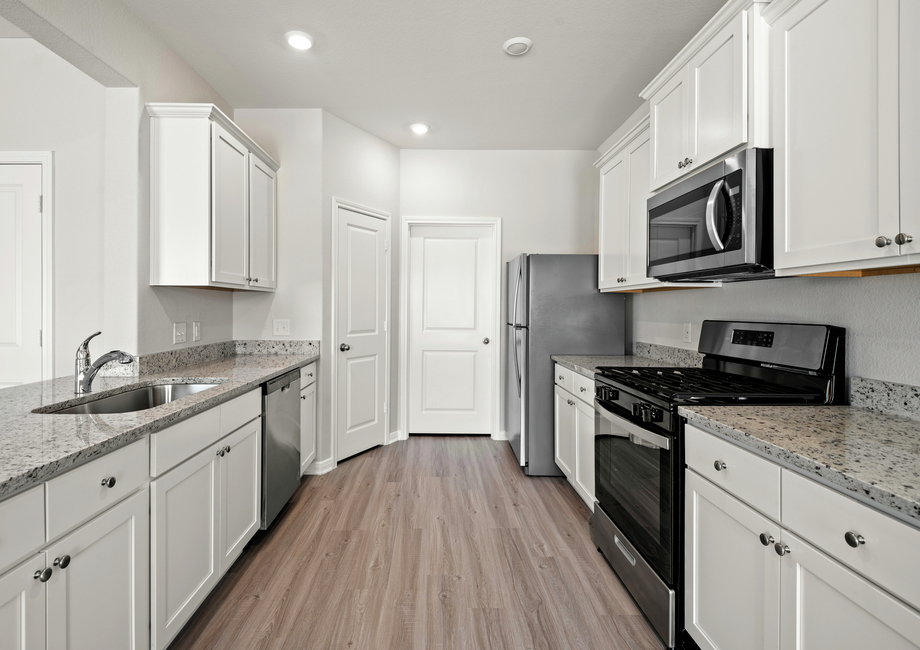 Stainless steel appliances and granite countertops in the kitchen