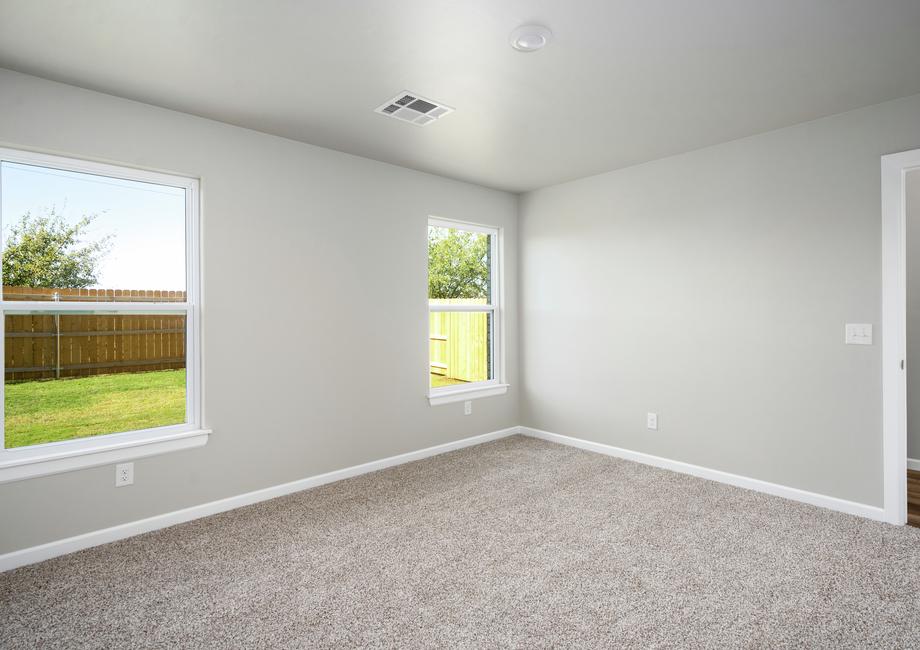 The master bedroom has two large windows that allow in great natural light.