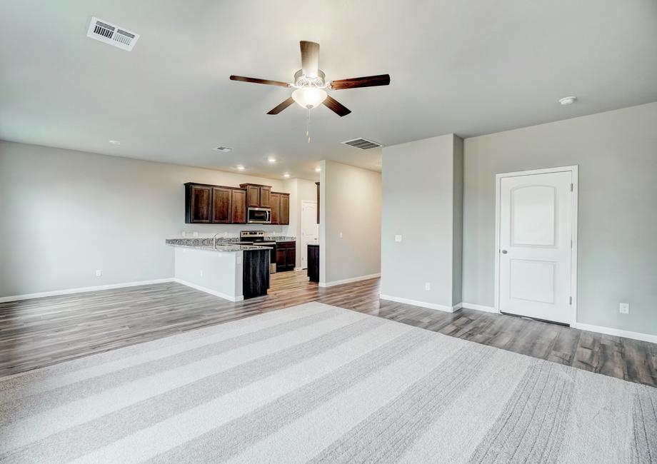 Natural lighting enters the home's open family room, dining area and chef-ready kitchen.