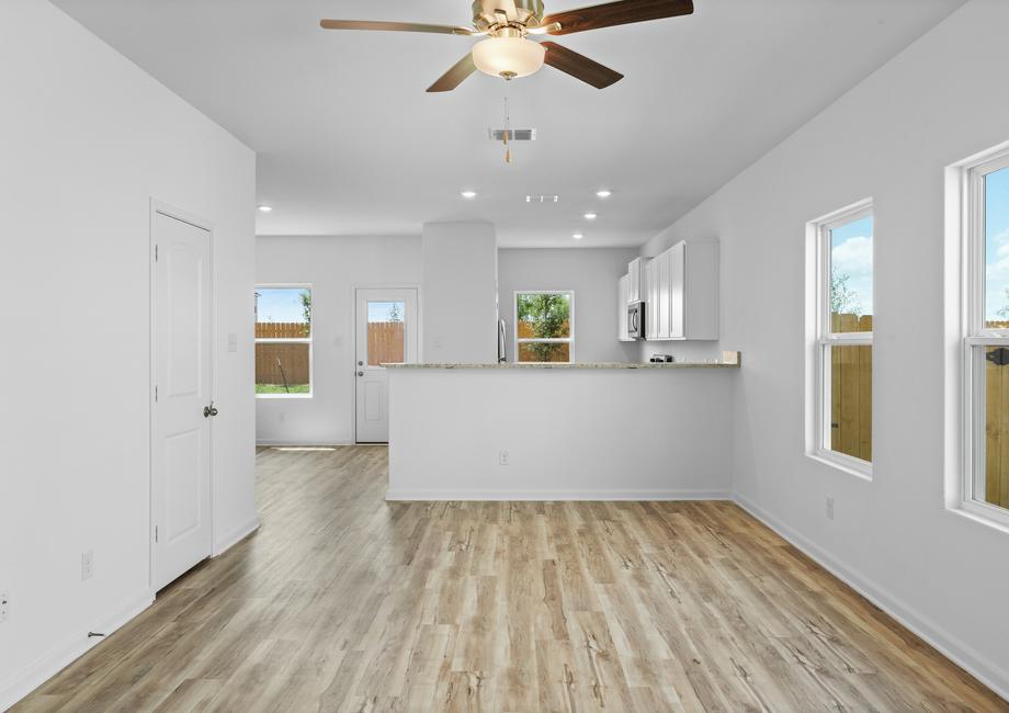 A spacious family room leads to the chef-ready kitchen