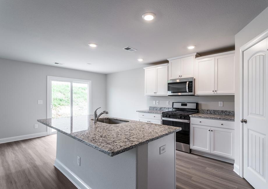 Kitchen with stainless  steel appliances.