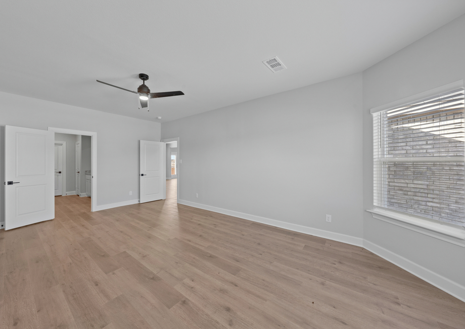 The master suite has a large bedroom, ensuite bathroom and a walk-in closet.