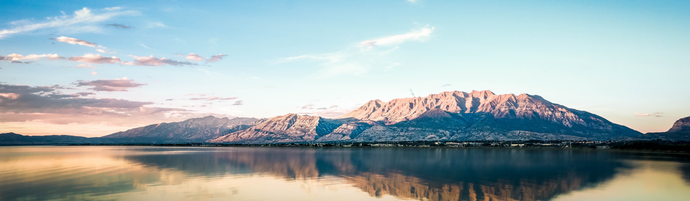 Mountains surrounded by a lake.
