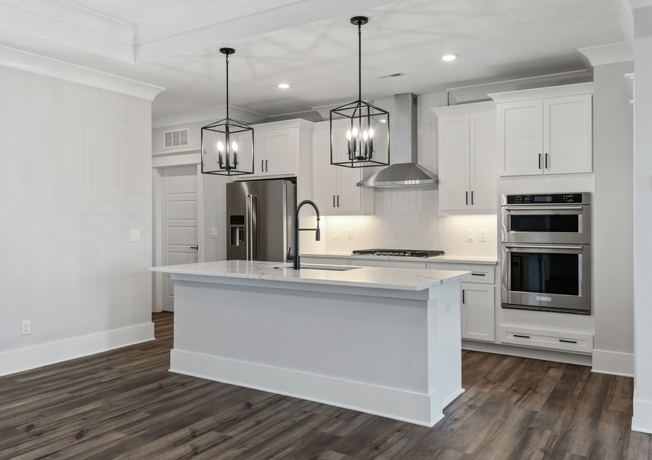 Stunning white cabinets and a large kitchen island.