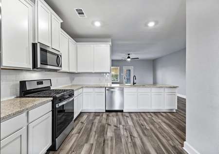 The kitchen of the Michigan plan includes energy-efficient, stainless-steel appliances.