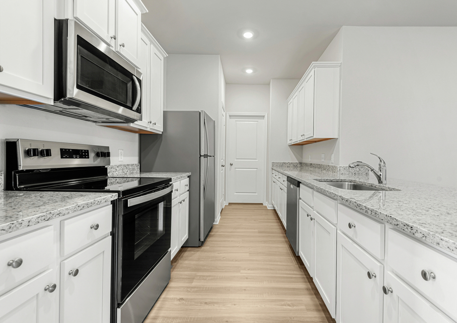 Chef-ready kitchen with granite countertops and stainless steel appliances