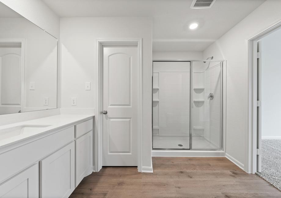 The master bathroom of the Reed  has a large walk-in, glass shower.