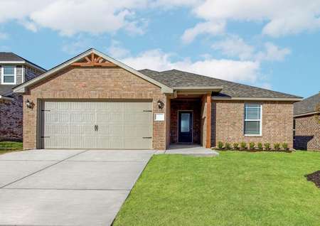 Beautiful brick home exterior with a large yard and driveway.