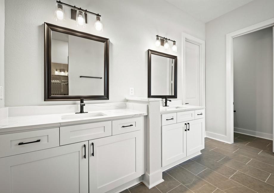 The master bathroom has a dual-sink vanity.