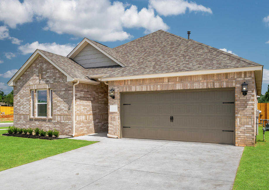 The Keystone has a large front yard and driveway.