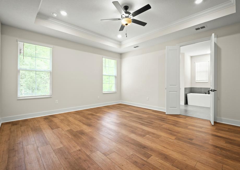 The master bedroom has wood floors.