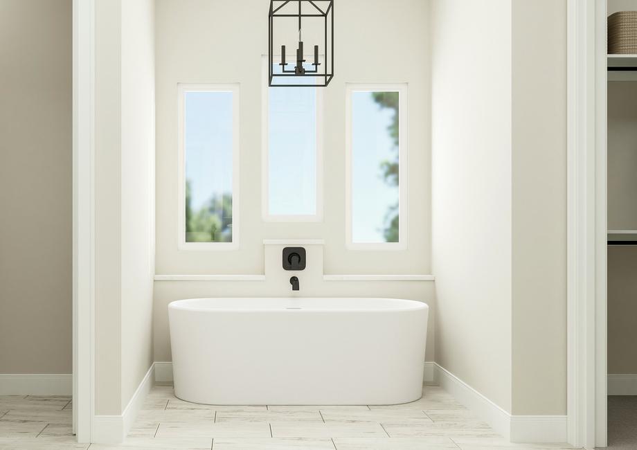 Rendering of the master bathoom's
  freestanding soaking tub in front of three windows and a dark chandelier.