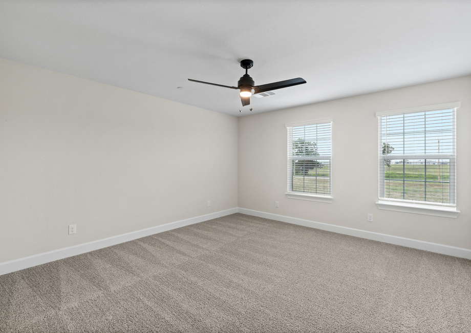 The master bedroom has two large windows that let in great, natural light.