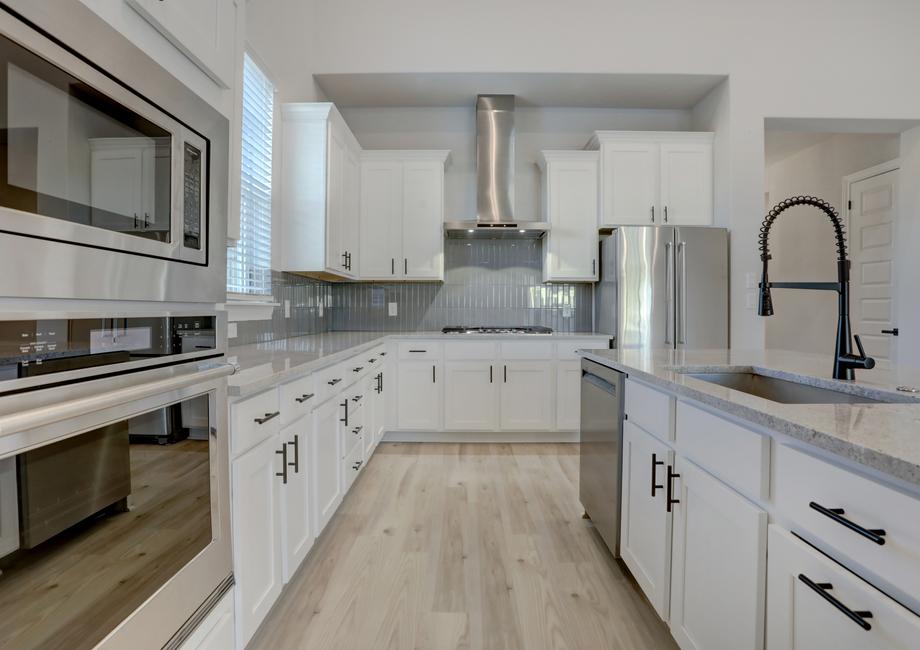 Chef-ready kitchen with stainless steel appliances and a timeless elegance.