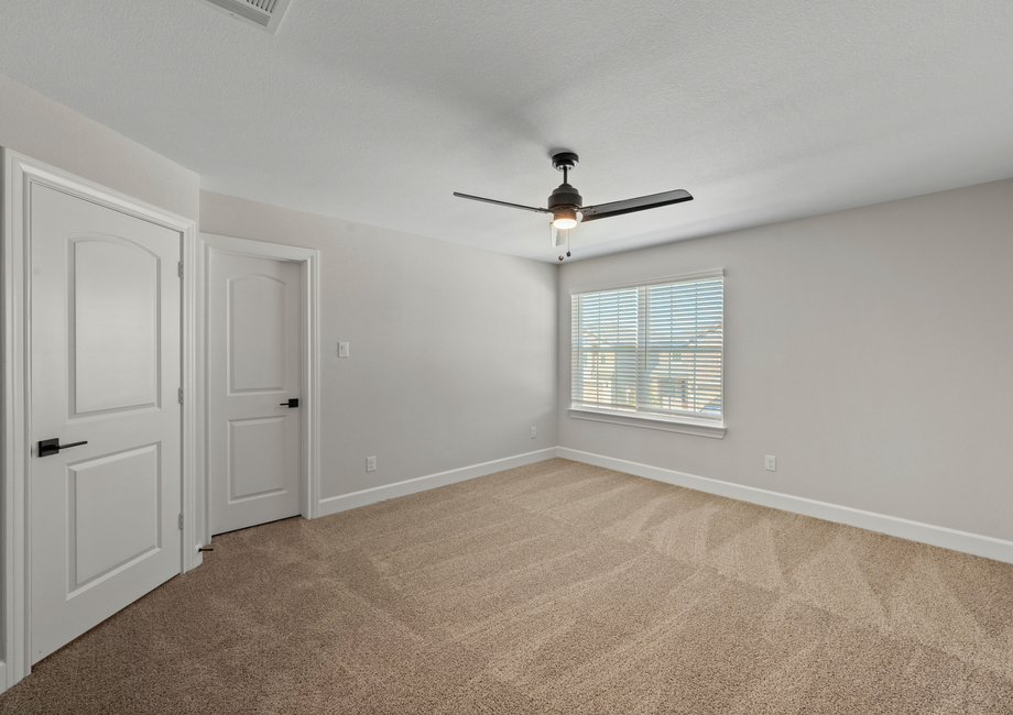 The master bedroom has large windows that let in great, natural light.