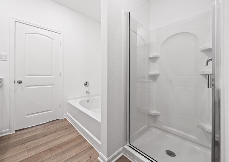 A walk-in shower and soaking tub can also be found in the master bath.