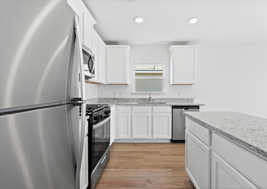The kitchen comes with stainless steel appliances.