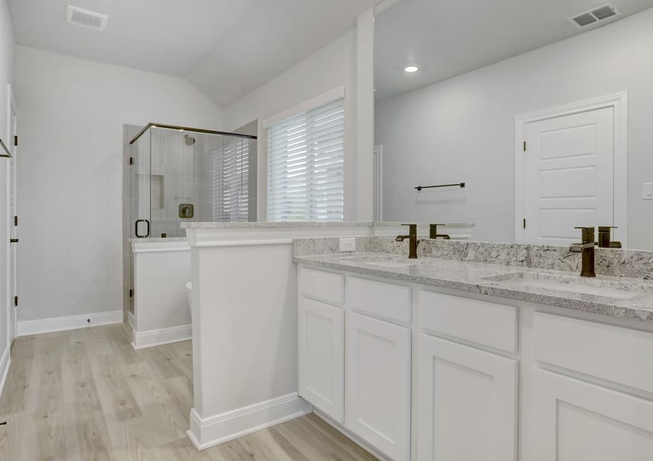 The master bathroom features a double-sink vanity.