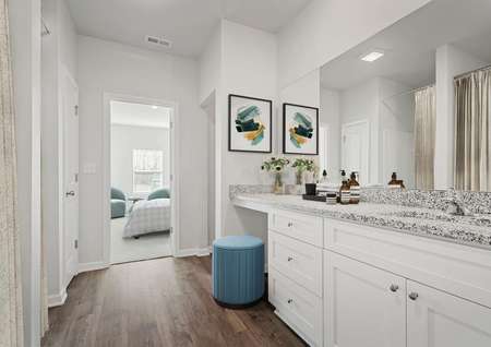 The Cypress master bathroom has a step in shower and soaking tub.