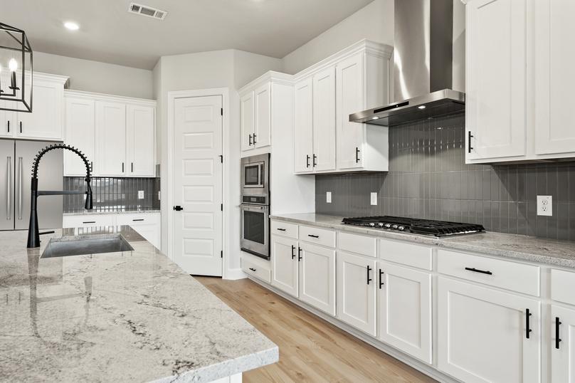 The fully loaded kitchen comes with stainless steel appliances.