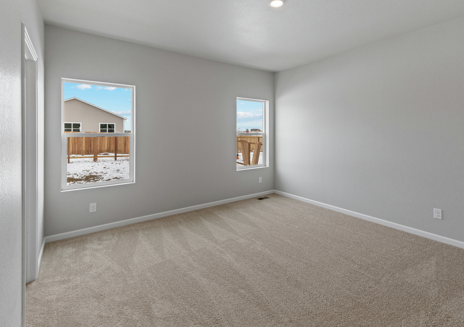 The master bedroom has two large windows that let in great natural light.