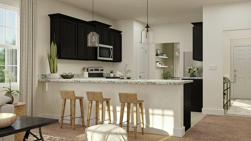 Staged view of breakfast bar and kitchen.