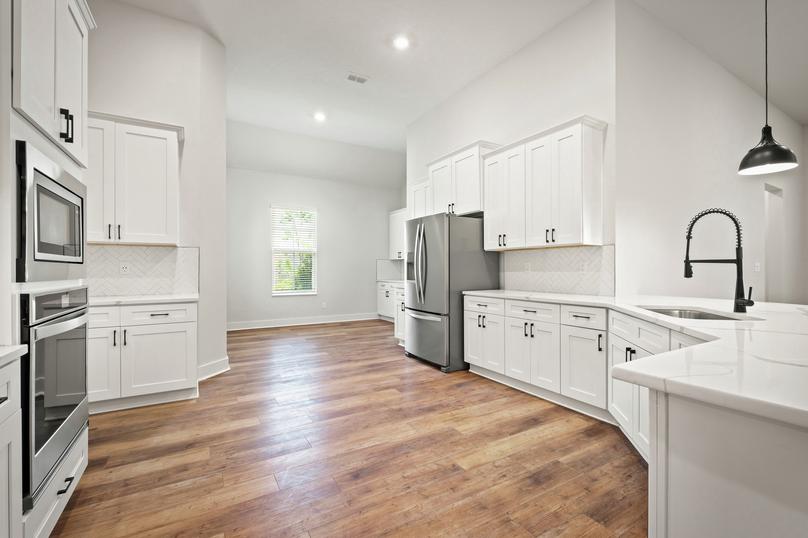 The chef ready kitchen includes stainless steel appliances.