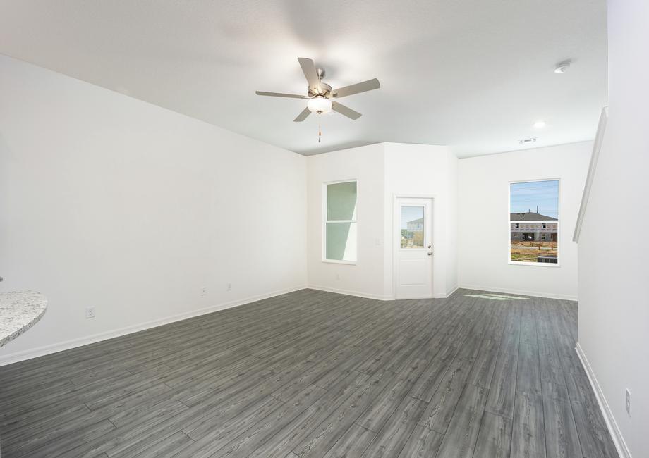 A family room and adjoining dining room