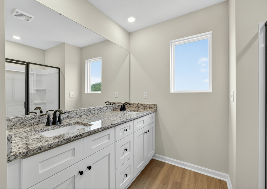 The master bathroom has dual sinks. 