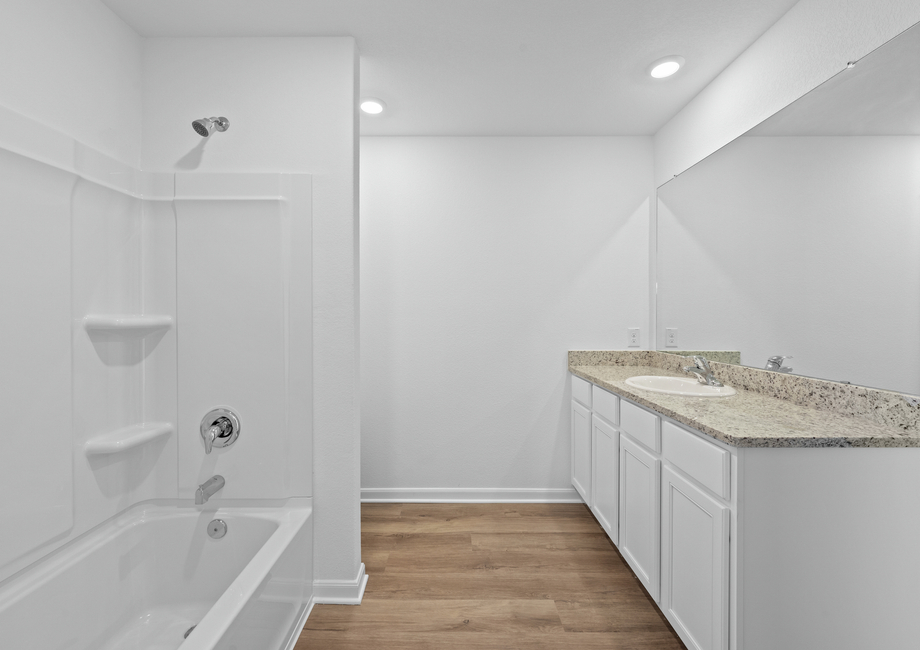 A large granite vanity in the master bathroom