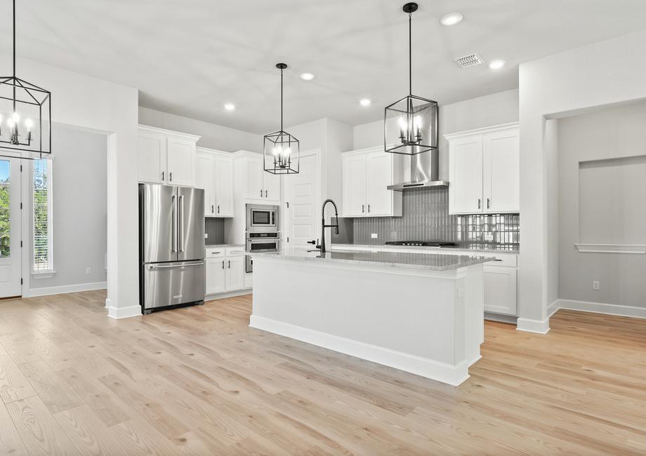 The chef-ready kitchen features a gorgeous island and stainless steel appliances.