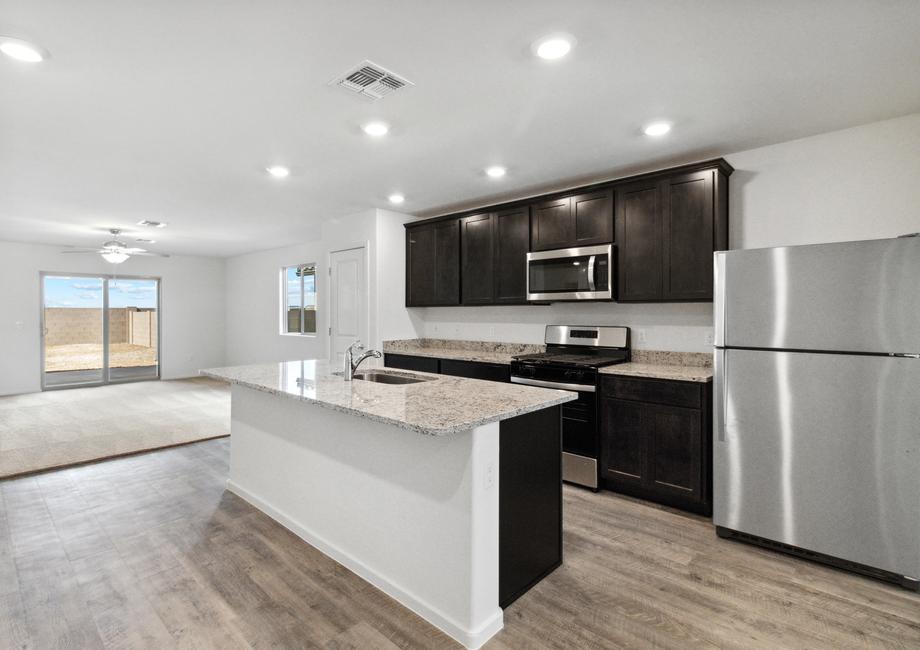 Chef-ready kitchen with large island and expansive countertop space.