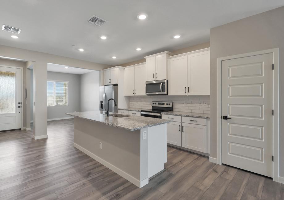 As you walk into the Bisbee, you are greeted by the stunning kitchen with designer finishes.
