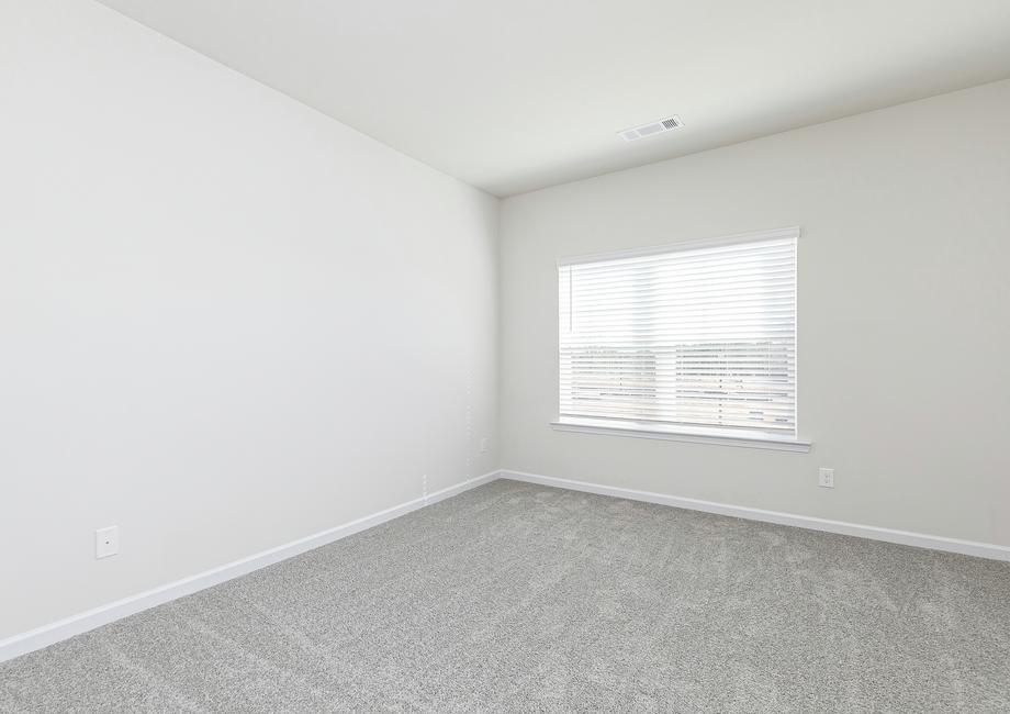 Rest and relaxation await in the master bedroom