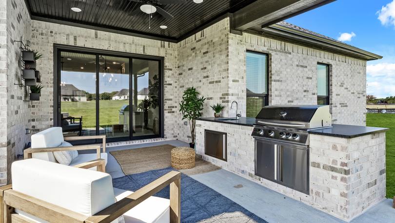 Outdoor kitchen is the perfect space for grilling out on the weekends.