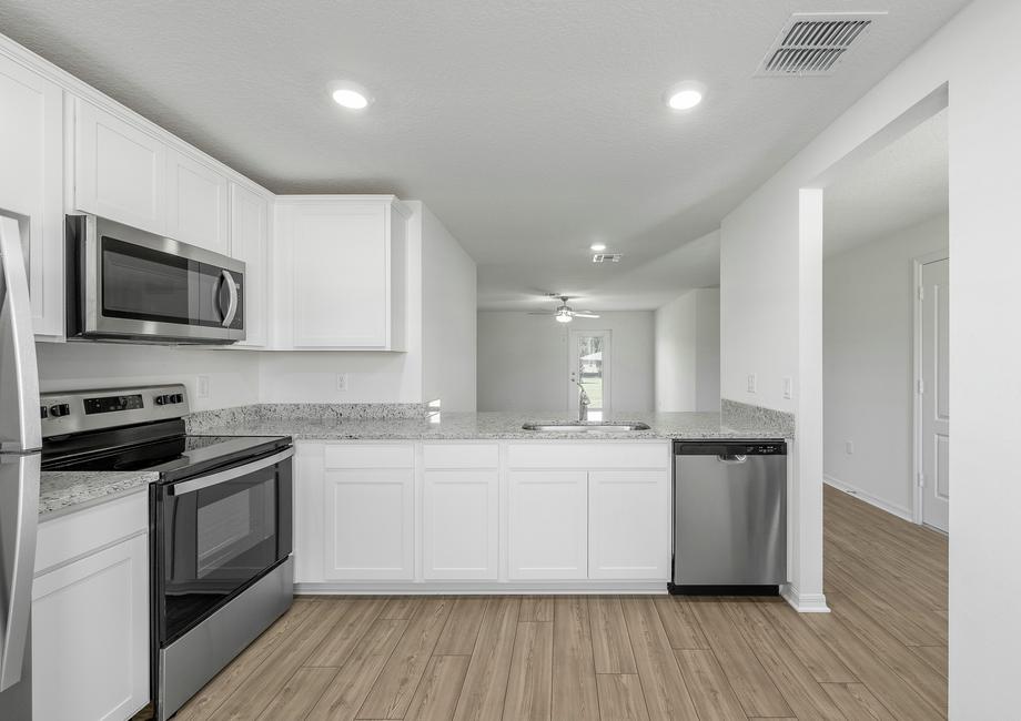 The kitchen overlooks the family room.