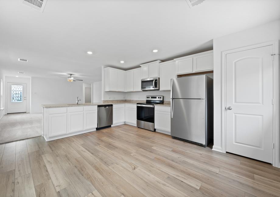 Enjoy cooking in a kitchen filled with stainless steel appliances and granite countertops