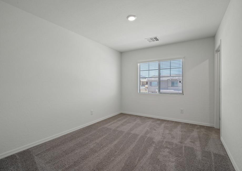 The secondary bedroom has carpet. 