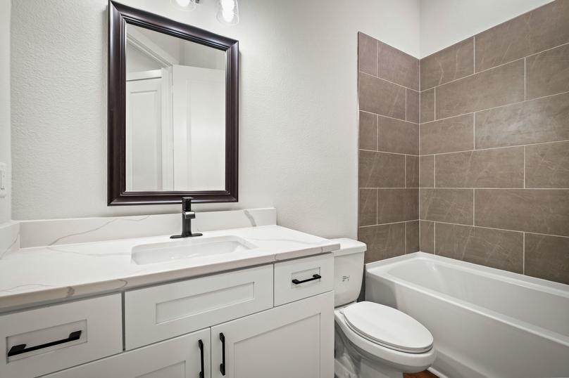 Matte black hardware is already on the gorgeous white cabinets.