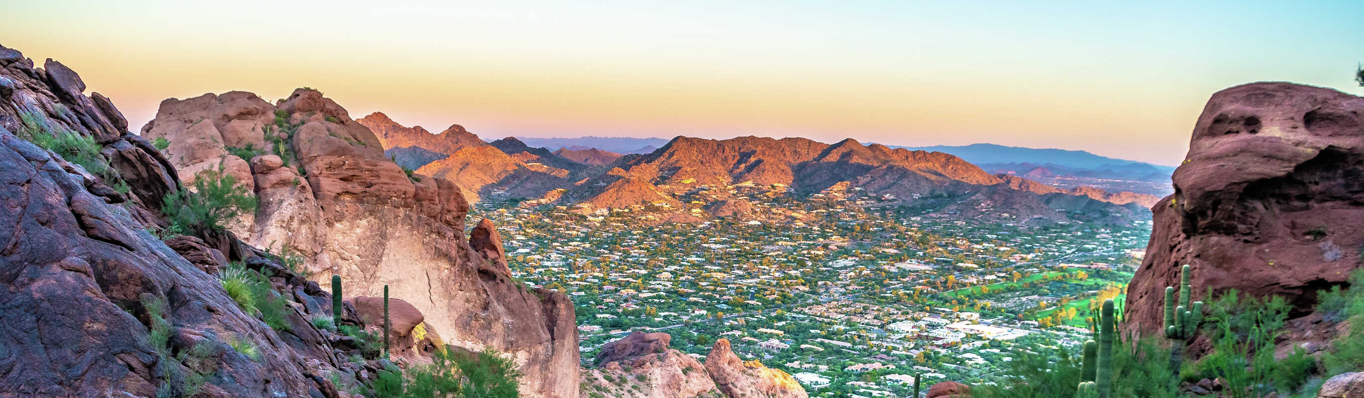 Phoenix, Arizona Camelback Mountain from the top looking down on numerous desert plants, cacti, and multi-colored rocks